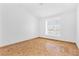 Bedroom featuring parquet flooring and a window for natural light at 5513 Escallonia St, Las Vegas, NV 89149