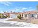 A charming single-story home with desert landscaping, two-car garage, and well-maintained front yard at 5513 Escallonia St, Las Vegas, NV 89149