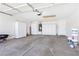 Spacious garage with bright lighting, storage cabinets, and concrete flooring at 5513 Escallonia St, Las Vegas, NV 89149