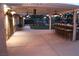 Night view of the property's outdoor kitchen with a bar and a fountain, with string lighting in the backyard at 5854 Sheila Ave, Las Vegas, NV 89108