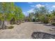Expansive backyard features mature trees, offering privacy and a natural setting at 5854 Sheila Ave, Las Vegas, NV 89108