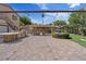 This large outdoor area has a brick layout, outdoor kitchen, water fountain, and artificial grass at 5854 Sheila Ave, Las Vegas, NV 89108
