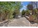 View of backyard landscaping and a brick wall with gravel and decorative accents at 5854 Sheila Ave, Las Vegas, NV 89108