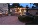 Backyard includes fountain, outdoor grill and eating area with a beautiful stone finish under string lights at 5854 Sheila Ave, Las Vegas, NV 89108