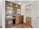 Chic bathroom features a vanity area, complemented by stylish tile backsplash at 5854 Sheila Ave, Las Vegas, NV 89108