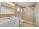A clean and bright bathroom with a shower over tub and updated fixtures at 5854 Sheila Ave, Las Vegas, NV 89108