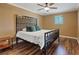 Bright bedroom with hardwood floors and a large window that offers plenty of natural light at 5854 Sheila Ave, Las Vegas, NV 89108
