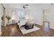Inviting bedroom featuring warm hardwood floors and a comfortable bed with stylish decor at 5854 Sheila Ave, Las Vegas, NV 89108