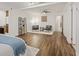 Spacious bedroom featuring hardwood floors, ceiling fan, and seating area for relaxation at 5854 Sheila Ave, Las Vegas, NV 89108