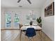 Dining area with backyard access, white walls, a modern table and chairs, and natural light at 5854 Sheila Ave, Las Vegas, NV 89108