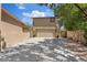 Long driveway alongside the home leading to a two-car garage and back entrance at 5854 Sheila Ave, Las Vegas, NV 89108