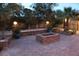 Backyard paver patio with block seating, a fire pit and landscaped plants at 5854 Sheila Ave, Las Vegas, NV 89108