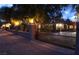 Night view of the property's wrought iron security gate and a segment of the block wall surrounding the property at 5854 Sheila Ave, Las Vegas, NV 89108