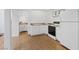 Kitchenette with white cabinets, a small sink, and an oven range and refrigerator at 5854 Sheila Ave, Las Vegas, NV 89108