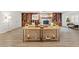 Large living space with a fireplace, custom built-ins, and wood-look floors at 5854 Sheila Ave, Las Vegas, NV 89108