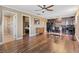 An open-concept living space with hardwood floors seamlessly connects the kitchen, bathroom, and bedroom at 5854 Sheila Ave, Las Vegas, NV 89108
