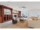 Cozy living room with a stone fireplace, built-in bookshelves, and lots of seating at 5854 Sheila Ave, Las Vegas, NV 89108