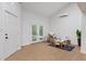 Bright living room featuring modern wood-look floors, lots of natural light, and a dedicated play area at 5854 Sheila Ave, Las Vegas, NV 89108