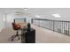 Office space with a desk and chair, featuring natural light and a view from the upper level at 5854 Sheila Ave, Las Vegas, NV 89108