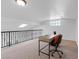 Upstairs office space features a desk, chair, and natural light from windows and a skylight at 5854 Sheila Ave, Las Vegas, NV 89108