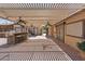 Beautiful outdoor kitchen area with ample seating, a grill, and a stylish pergola for shade at 5854 Sheila Ave, Las Vegas, NV 89108