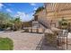 Spacious outdoor kitchen with a built-in grill, bar seating, and a charming pergola with string lights at 5854 Sheila Ave, Las Vegas, NV 89108