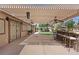 Backyard boasts an outdoor kitchen, bar with seating, and pergola with fan for entertaining guests at 5854 Sheila Ave, Las Vegas, NV 89108