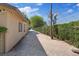 Functional side yard with secure fencing and ample space for storage or other uses at 5854 Sheila Ave, Las Vegas, NV 89108