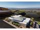 Contemporary luxury home featuring desert landscaping and views of the surrounding Ascaya community and distant mountains at 6 Rock Mount Ct, Henderson, NV 89012