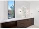 Modern bathroom features a sleek vanity with beautiful countertops and stylish fixtures, plus a large window at 6 Rock Mount Ct, Henderson, NV 89012