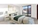Comfortable bedroom with large window, stylish decor, and neutral color palette at 6 Rock Mount Ct, Henderson, NV 89012