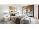 Bright bedroom with plush bedding, stylish decor, and a large sliding glass door leading to the outdoor area at 6 Rock Mount Ct, Henderson, NV 89012