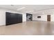 A large garage with custom storage cabinets and entry door to the house and backyard at 6 Rock Mount Ct, Henderson, NV 89012