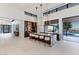 Spacious kitchen with large marble island, bar, and view of the backyard at 6 Rock Mount Ct, Henderson, NV 89012