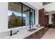 Gourmet kitchen features marble countertops, modern appliances, custom cabinetry, and a large window with a view at 6 Rock Mount Ct, Henderson, NV 89012