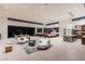 Spacious open-concept area with modern kitchen and living spaces that have access to the outside patio at 6 Rock Mount Ct, Henderson, NV 89012