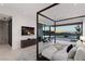 Serene main bedroom with canopy bed, city views, and access to outdoor patio at 6 Rock Mount Ct, Henderson, NV 89012