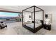 Bright main bedroom with modern decor, four-poster bed and outdoor access at 6 Rock Mount Ct, Henderson, NV 89012