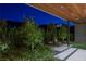 Relaxing outdoor patio area with comfortable seating surrounded by lush landscaping at 6 Rock Mount Ct, Henderson, NV 89012