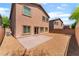 A backyard featuring gravel and a brick patio, providing a simple and low-maintenance outdoor space at 6125 Paddleboat St, North Las Vegas, NV 89031