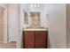 Bathroom features a dark wood vanity and bright lighting at 6125 Paddleboat St, North Las Vegas, NV 89031
