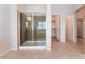 Bathroom featuring tiled floor, glass shower, and entry to walk-in closet at 6125 Paddleboat St, North Las Vegas, NV 89031