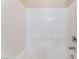 The bathtub has white tile surround and chrome fixtures at 6125 Paddleboat St, North Las Vegas, NV 89031