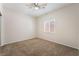 Cozy bedroom with ceiling fan, carpet, and window at 6125 Paddleboat St, North Las Vegas, NV 89031