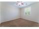 Bedroom featuring neutral walls, carpet floors, a ceiling fan, and a window with blinds at 6125 Paddleboat St, North Las Vegas, NV 89031