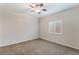 Comfortable bedroom featuring a ceiling fan, neutral walls, carpeted floors, and a window for natural light at 6125 Paddleboat St, North Las Vegas, NV 89031
