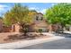 Attractive two-story home with a front-facing two-car garage and low-maintenance landscaping at 6125 Paddleboat St, North Las Vegas, NV 89031