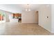 Open-concept living space with tile flooring flowing seamlessly into the adjacent kitchen and dining areas at 6125 Paddleboat St, North Las Vegas, NV 89031