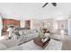 Bright and airy living room with a modern design, seamlessly connecting to the dining area and kitchen at 6125 Paddleboat St, North Las Vegas, NV 89031