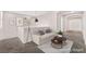 Upstairs loft area is virtually staged with a cozy sofa and contemporary décor for a comfortable retreat at 6125 Paddleboat St, North Las Vegas, NV 89031